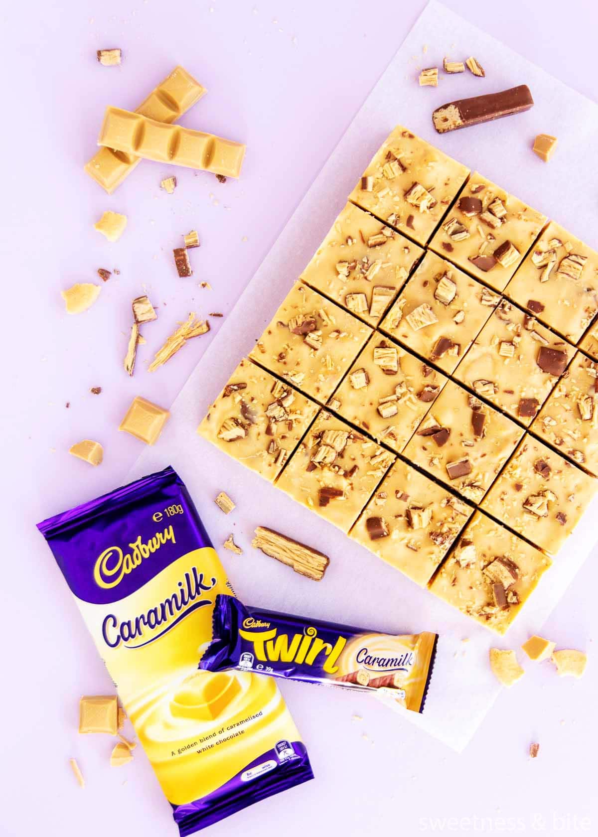 16 squares of slice, with a wrapped block of Caramilk chocolate and a Caramilk Twirl. 