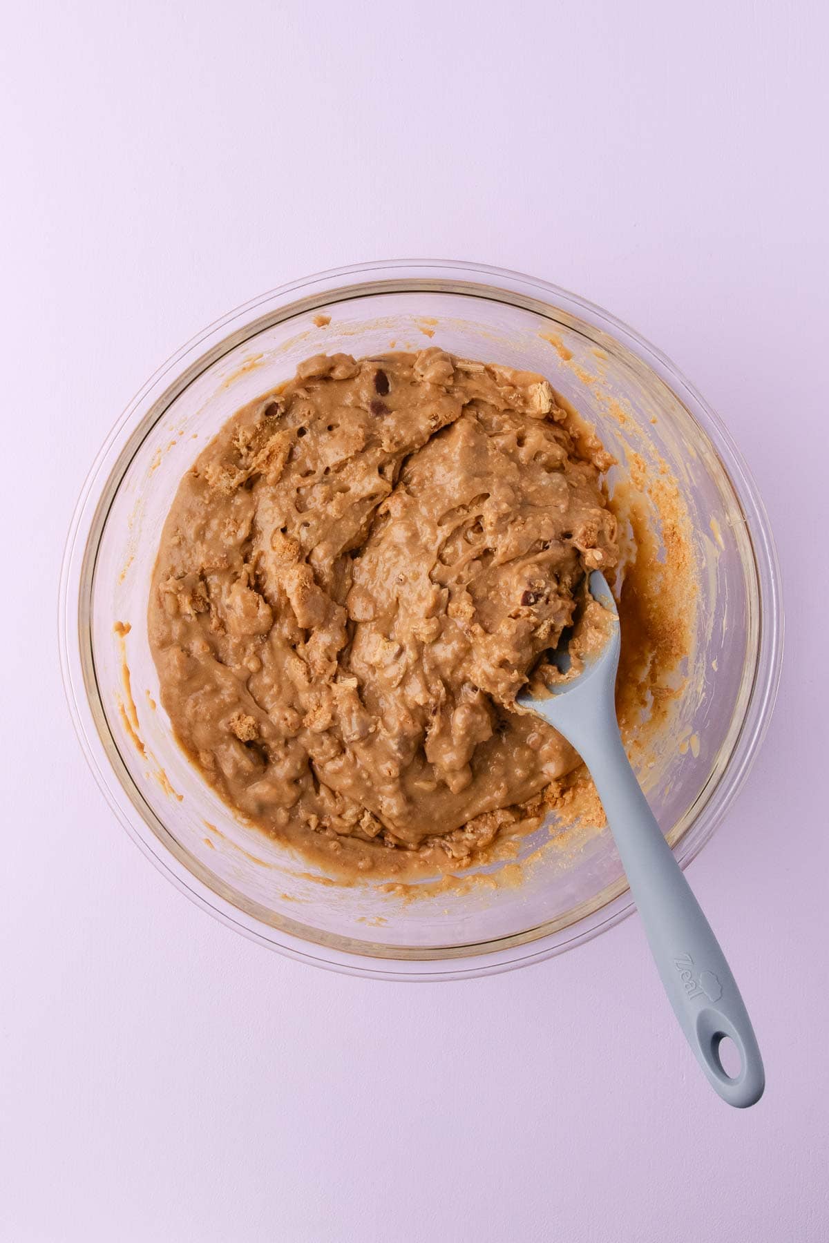 The chopped biscuits and twirls being stirred into the fudge mixture. 