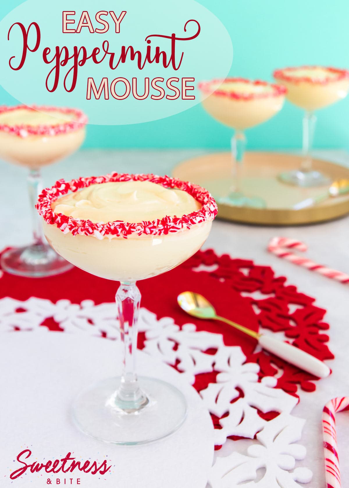 Easy peppermint mousse served in a cocktail glass, with crushed candy canes around the rim of the glass. 