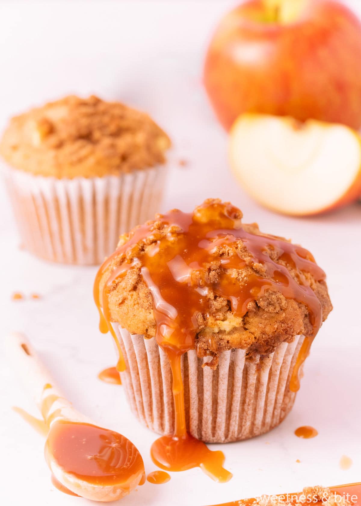 A apple muffin drizzled with rum caramel sauce.