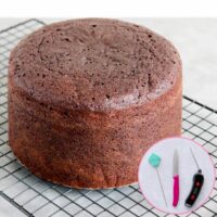 A chocolate cake on a wire cooling rack, inlaid image shows the tools used to tell if a cake is done.