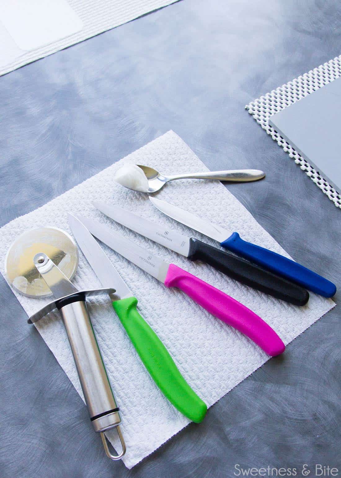 Small sharp knives and a pizza cutter wheel.