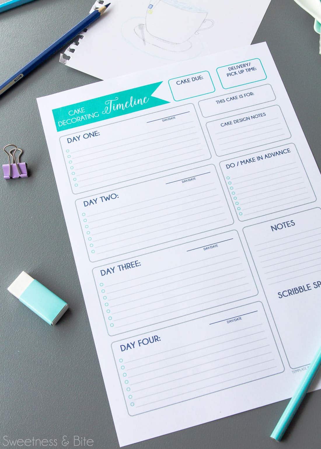 The printed cake decorating timeline sheet, with a pencil and eraser.