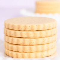 A stack of gluten free vanilla cookies on a white plate.