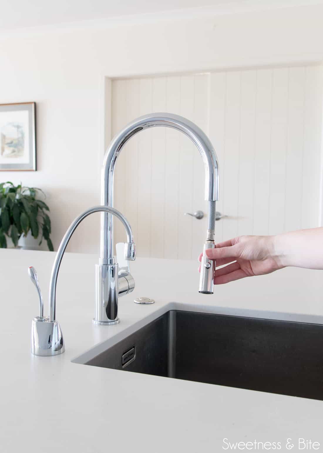 The kitchen tap, with the pull-out hose at the end, and a boiling-water tap next to it.